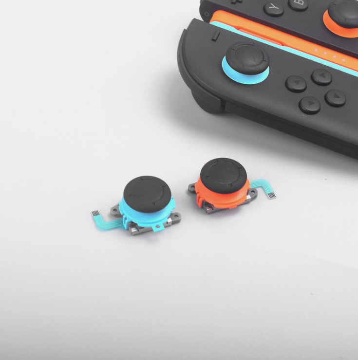 Two joystick buttons with black caps on a white background Nintendo Switch 2 Joystick Replacement