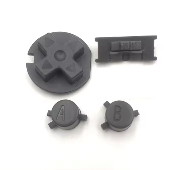 Set of black plastic components on a white background