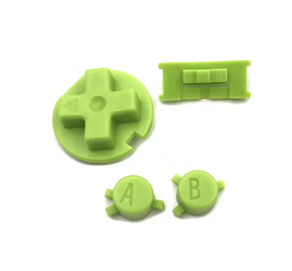 Set of green plastic buttons and joystick on a white background